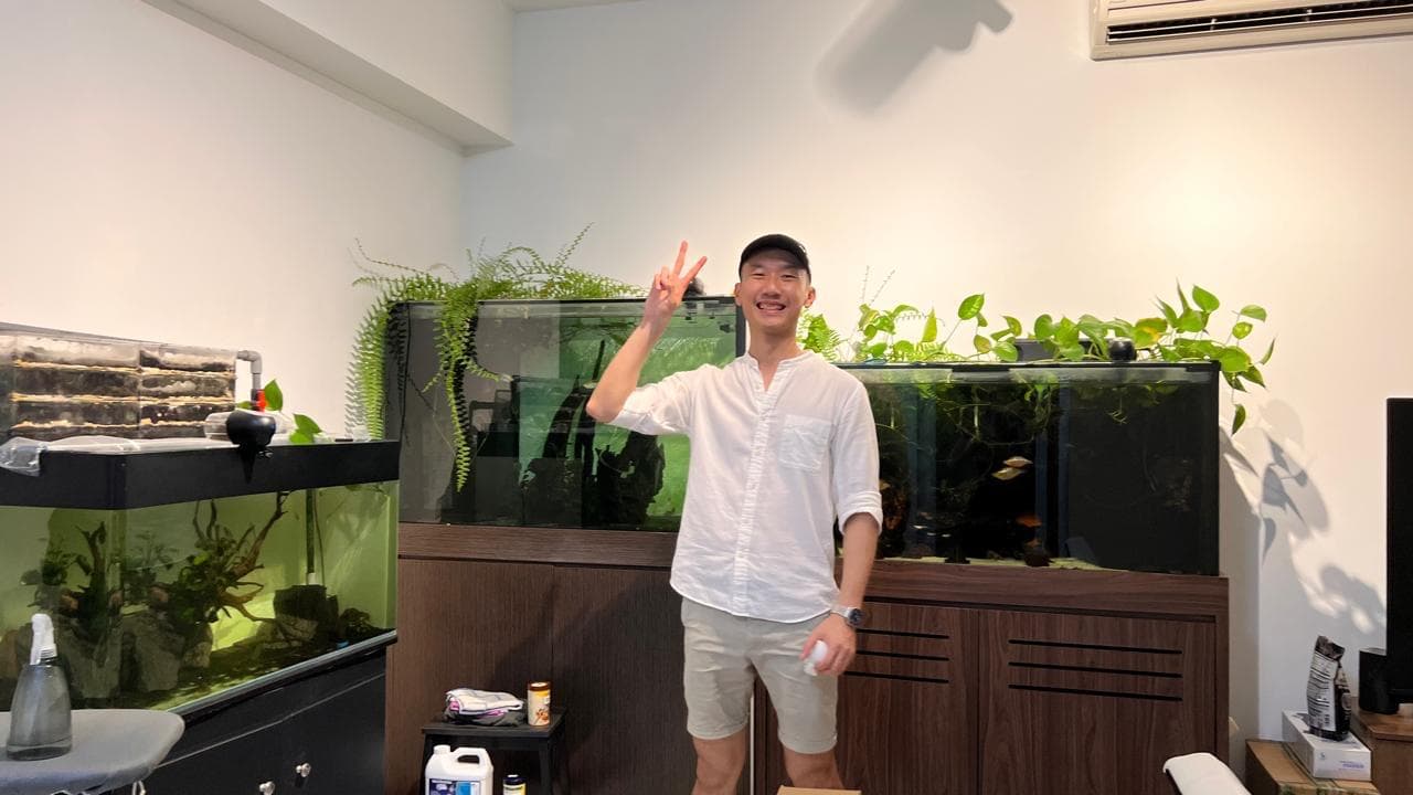 Toni at home in front of his planted aquariums
